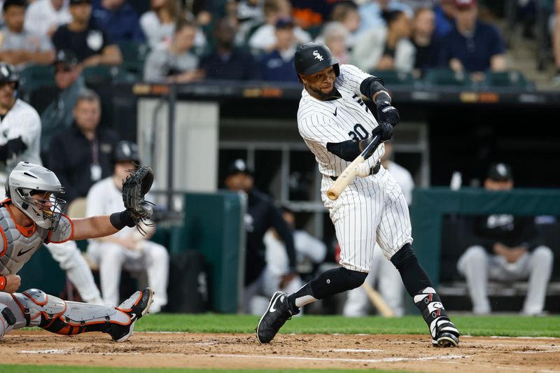 May 24, 2024; Chicago, Illinois, USA; Chicago White Sox outfielder Corey Julks (30) doubles against the Baltimore Orioles during the second inning at Guaranteed Rate Field. Mandatory Credit: Kamil Krzaczynski-USA TODAY Sports