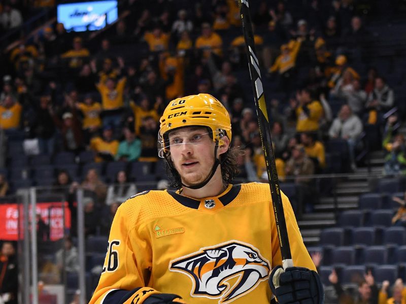 Jan 9, 2024; Nashville, Tennessee, USA; Nashville Predators center Philip Tomasino (26) after scoring a goal during the third period against the Anaheim Ducks at Bridgestone Arena. Mandatory Credit: Christopher Hanewinckel-USA TODAY Sports