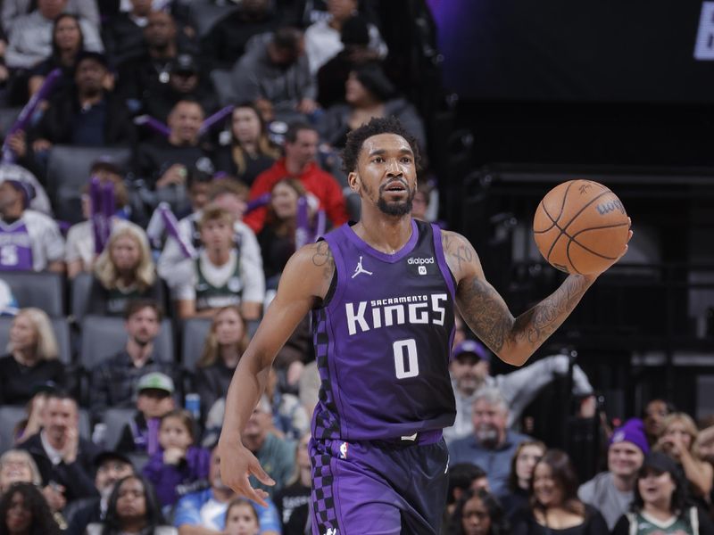 SACRAMENTO, CA - MARCH 12: Malik Monk #0 of the Sacramento Kings dribbles the ball during the game against the Milwaukee Bucks on March 12, 2024 at Golden 1 Center in Sacramento, California. NOTE TO USER: User expressly acknowledges and agrees that, by downloading and or using this Photograph, user is consenting to the terms and conditions of the Getty Images License Agreement. Mandatory Copyright Notice: Copyright 2024 NBAE (Photo by Rocky Widner/NBAE via Getty Images)