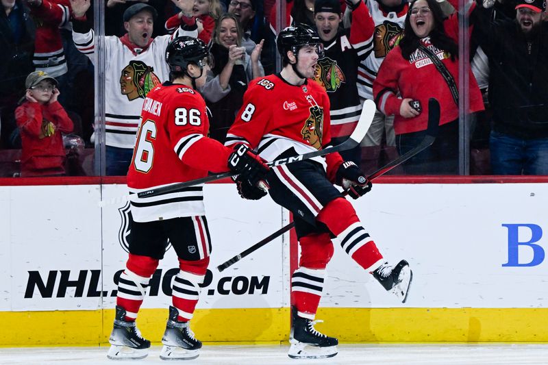 Mar 6, 2026; Chicago, Illinois, USA;  Chicago Blackhawks center Ryan Donato (8) celebrates his goal with center Teuvo Teravainen (86) against the Vancouver Canucks during the first period at United Center. Mandatory Credit: Matt Marton-Imagn Images