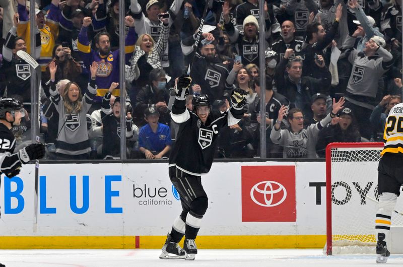 Feb 11, 2023; Los Angeles, California, USA;  Los Angeles Kings center Anze Kopitar (11) celebrates after the fourth goal of the game by Los Angeles Kings right wing Adrian Kempe (not pictured) in the third period against the Pittsburgh Penguins at Crypto.com Arena.  Mandatory Credit: Jayne Kamin-Oncea-USA TODAY Sports