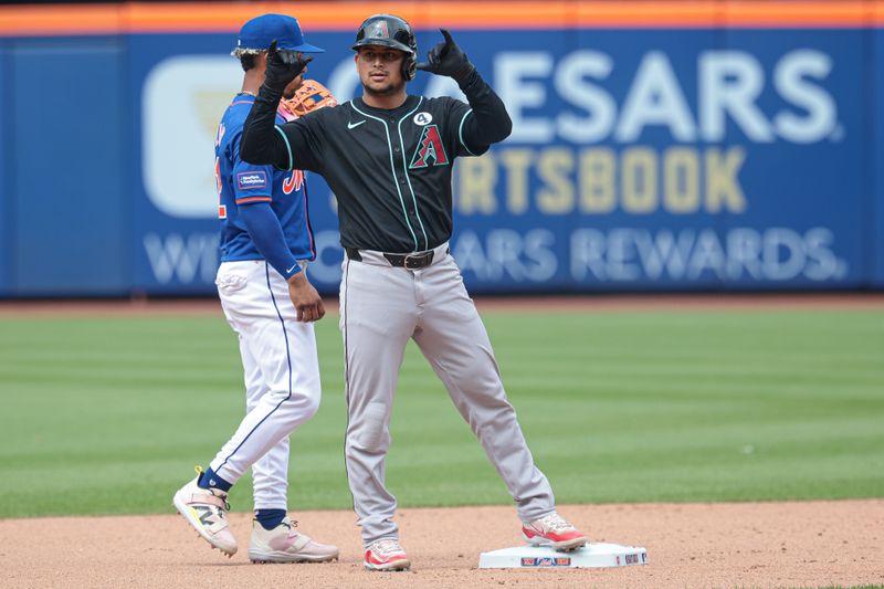 Jun 2, 2024; New York City, New York, USA; Arizona Diamondbacks catcher Gabriel Moreno (14) reacts after a double during the ninth inning against the New York Mets  at Citi Field. Mandatory Credit: Vincent Carchietta-USA TODAY Sports