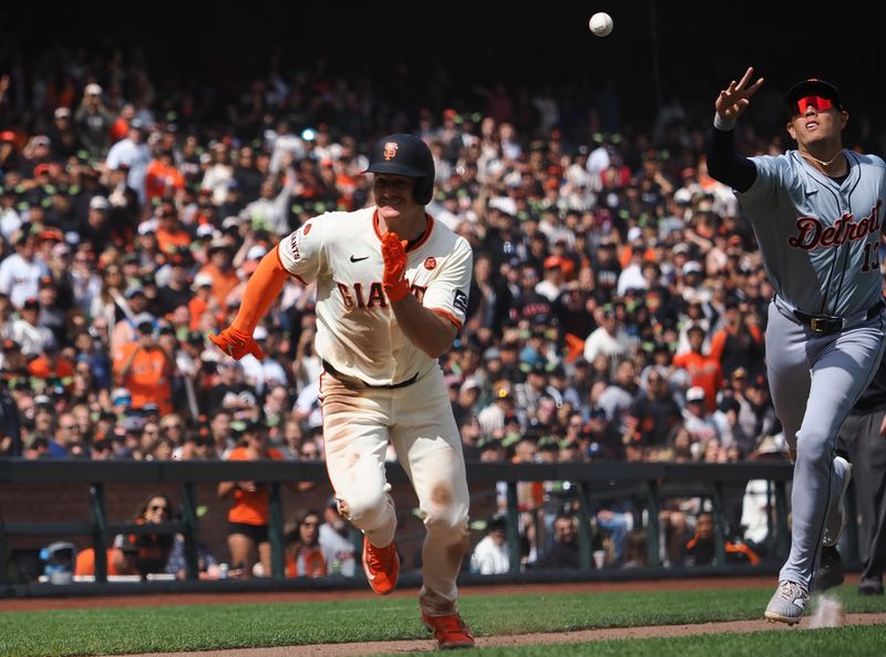 Aug 11, 2024; San Francisco, California, USA; San Francisco Giants third baseman Matt Chapman (26) is caught between Detroit Tigers catcher Dillon Dingler (38) and third baseman Gio Urshela (13) during the eighth inning at Oracle Park. Mandatory Credit: Kelley L Cox-USA TODAY Sports