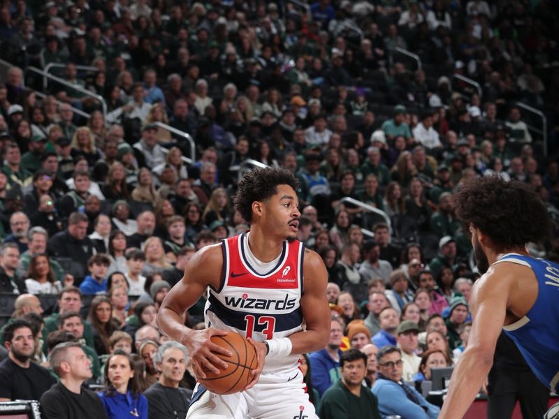 MILWAUKEE, WI - NOVEMBER 30: Jordan Poole #13 of the Washington Wizards handles the ball during the game against the Milwaukee Bucks on November 30, 2024 at Fiserv Forum Center in Milwaukee, Wisconsin. NOTE TO USER: User expressly acknowledges and agrees that, by downloading and or using this Photograph, user is consenting to the terms and conditions of the Getty Images License Agreement. Mandatory Copyright Notice: Copyright 2024 NBAE (Photo by Gary Dineen/NBAE via Getty Images).
