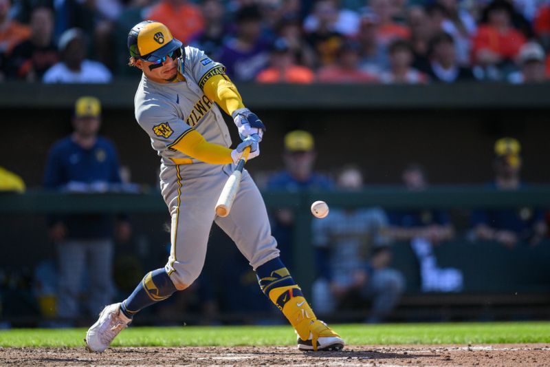 Apr 14, 2024; Baltimore, Maryland, USA; Milwaukee Brewers catcher William Contreras (24) hits a single during the ninth inning against the Baltimore Orioles at Oriole Park at Camden Yards. Mandatory Credit: Reggie Hildred-USA TODAY Sports