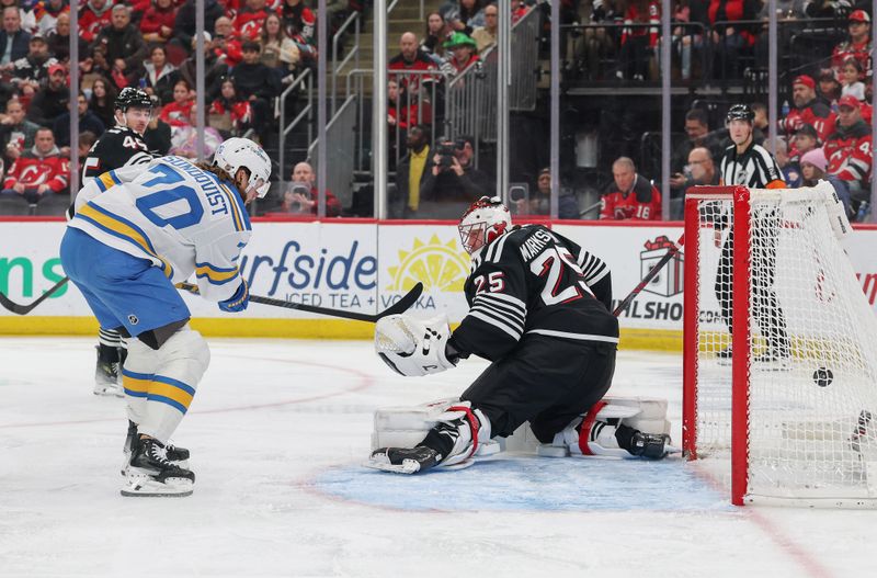 Nov 26, 2025; Newark, New Jersey, USA; St. Louis Blues defenseman Cam Fowler (17) (not pictured) scores a goal on New Jersey Devils goaltender Jacob Markstrom (25) during the first period at Prudential Center. Mandatory Credit: Ed Mulholland-Imagn Images