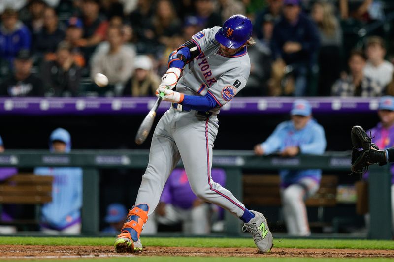 Jun 6, 2025; Denver, Colorado, USA; New York Mets center fielder Jeff McNeil (1) hits a sacrifice fly in the ninth inning against the Colorado Rockies at Coors Field. Mandatory Credit: Isaiah J. Downing-Imagn Images