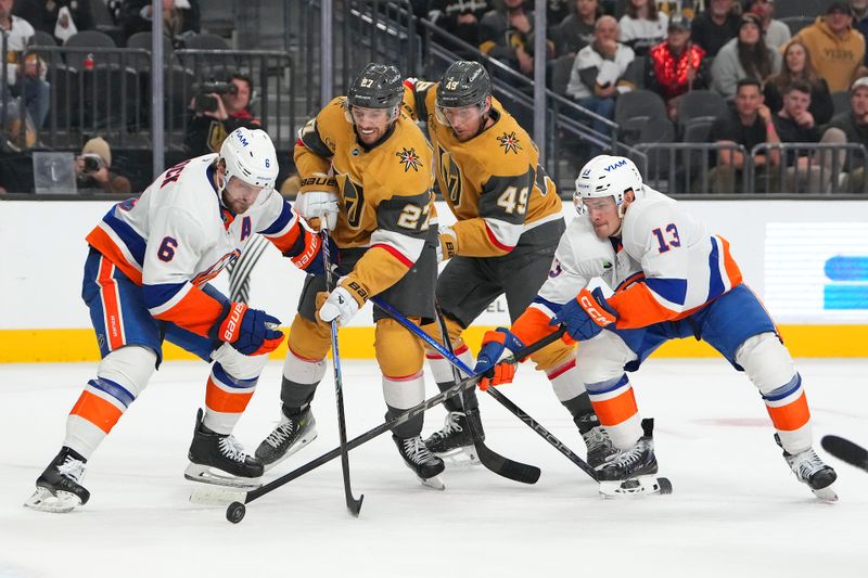 Nov 13, 2025; Las Vegas, Nevada, USA; New York Islanders defenseman Ryan Pulock (6) and center Mathew Barzal (13) protect the puck from Vegas Golden Knights defenseman Shea Theodore (27) and left wing Ivan Barbashev (49) during the third period at T-Mobile Arena. Mandatory Credit: Stephen R. Sylvanie-Imagn Images