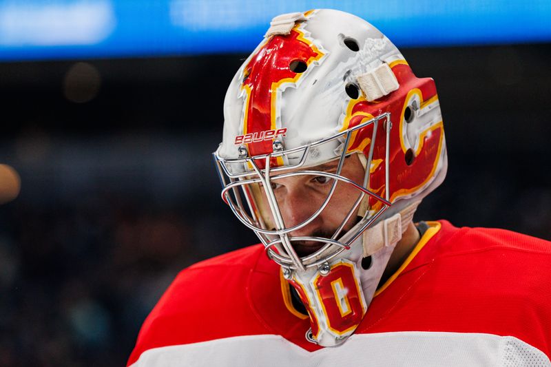 Oct 19, 2024; Seattle, Washington, USA; Calgary Flames goaltender Dan Vladar (80) looks on during the first period against the Seattle Kraken at Climate Pledge Arena. Mandatory Credit: Caean Couto-Imagn Images