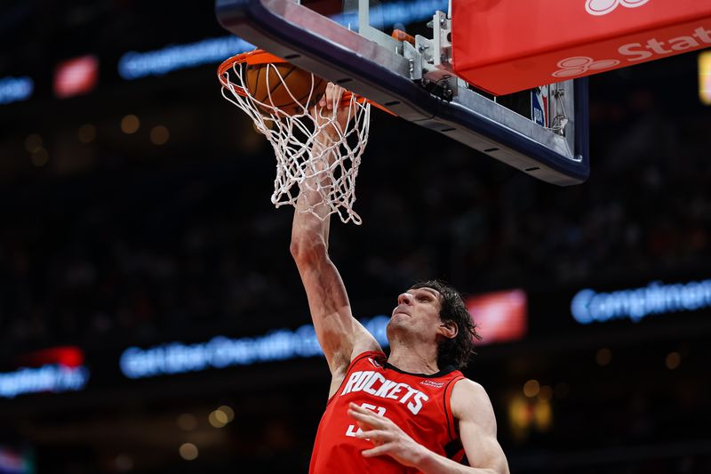 WASHINGTON, DC - APRIL 09: Boban Marjanovic #51 of the Houston Rockets dunks against the Washington Wizards during the first half at Capital One Arena on April 9, 2023 in Washington, DC. NOTE TO USER: User expressly acknowledges and agrees that, by downloading and or using this photograph, User is consenting to the terms and conditions of the Getty Images License Agreement. (Photo by Scott Taetsch/Getty Images)