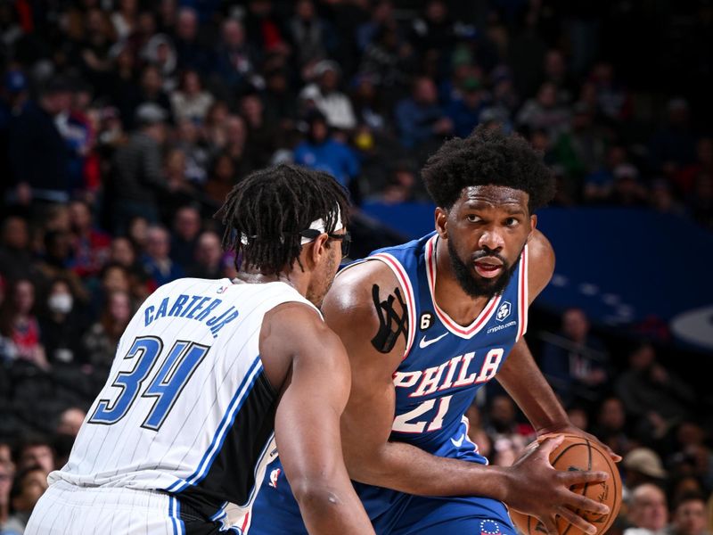 PHILADELPHIA, PA - FEBRUARY 1: Joel Embiid #21 of the Philadelphia 76ers handles the ball during the game against the Orlando Magic on February 1, 2023 at the Wells Fargo Center in Philadelphia, Pennsylvania NOTE TO USER: User expressly acknowledges and agrees that, by downloading and/or using this Photograph, user is consenting to the terms and conditions of the Getty Images License Agreement. Mandatory Copyright Notice: Copyright 2023 NBAE (Photo by David Dow/NBAE via Getty Images)