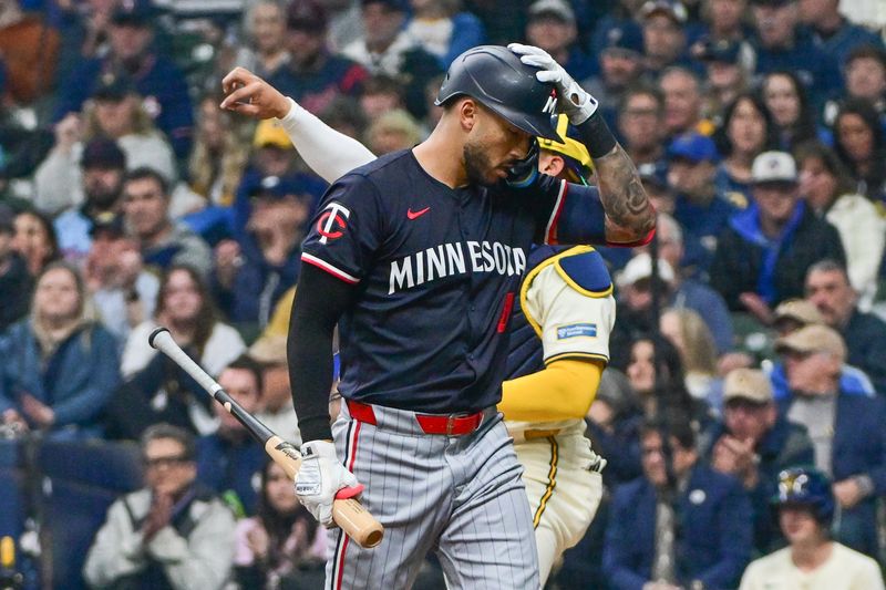 Apr 2, 2024; Milwaukee, Wisconsin, USA;  Minnesota Twins shortstop Carlos Correa (4) reacts after striking out in the second inning against the Milwaukee Brewers at American Family Field. Mandatory Credit: Benny Sieu-USA TODAY Sports