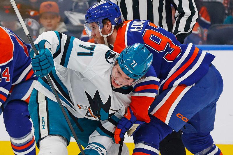 Jan 29, 2026; Edmonton, Alberta, CAN; San Jose Sharks forward Macklin Celebrini (71) and Edmonton Oilers forward Connor McDavid (97) battle for a loose puck during the second period at Rogers Place. Mandatory Credit: Perry Nelson-Imagn Images