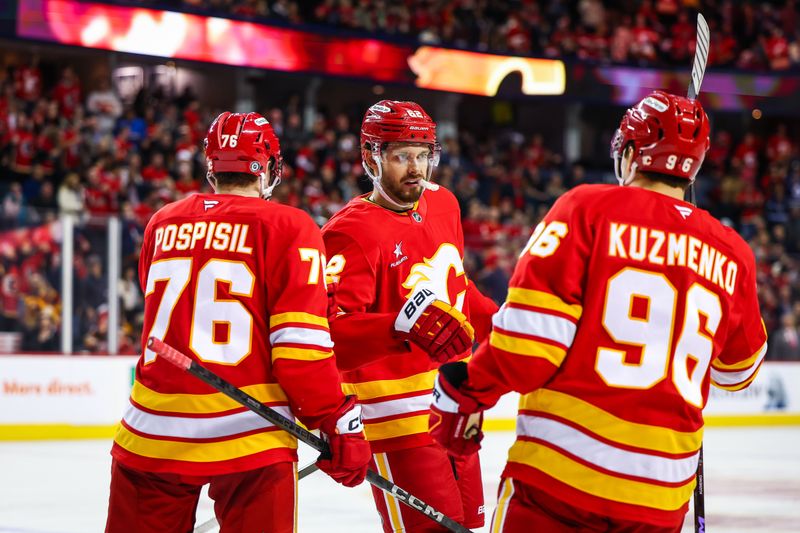 Nov 15, 2024; Calgary, Alberta, CAN; Calgary Flames defenseman Daniil Miromanov (62) celebrates his goal with teammates against the Nashville Predators during the third period at Scotiabank Saddledome. Mandatory Credit: Sergei Belski-Imagn Images