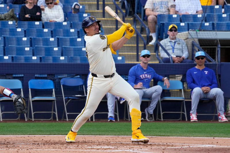 Mar 16, 2024; Phoenix, Arizona, USA; Milwaukee Brewers shortstop Willy Adames (27) hits against the Texas Rangers in the second inning at American Family Fields of Phoenix. Mandatory Credit: Rick Scuteri-USA TODAY Sports