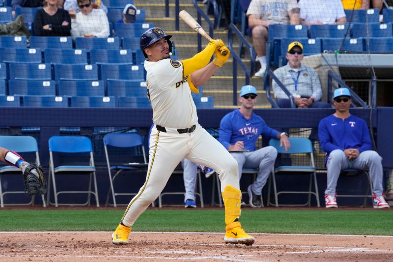 Mar 16, 2024; Phoenix, Arizona, USA; Milwaukee Brewers shortstop Willy Adames (27) hits against the Texas Rangers in the second inning at American Family Fields of Phoenix. Mandatory Credit: Rick Scuteri-USA TODAY Sports