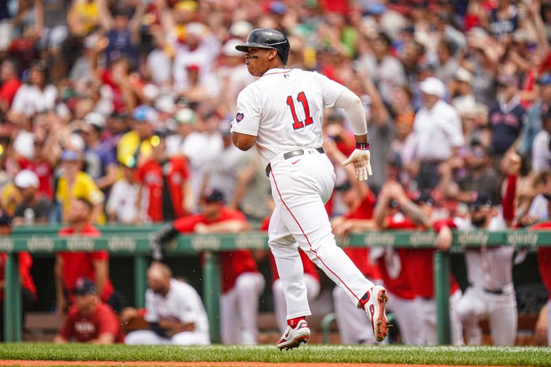Jun 30, 2024; Boston, Massachusetts, USA; Boston Red Sox third baseman Rafael Devers (11) hits a two run home run against the San Diego Padres in the first inning at Fenway Park. Mandatory Credit: David Butler II-USA TODAY Sports