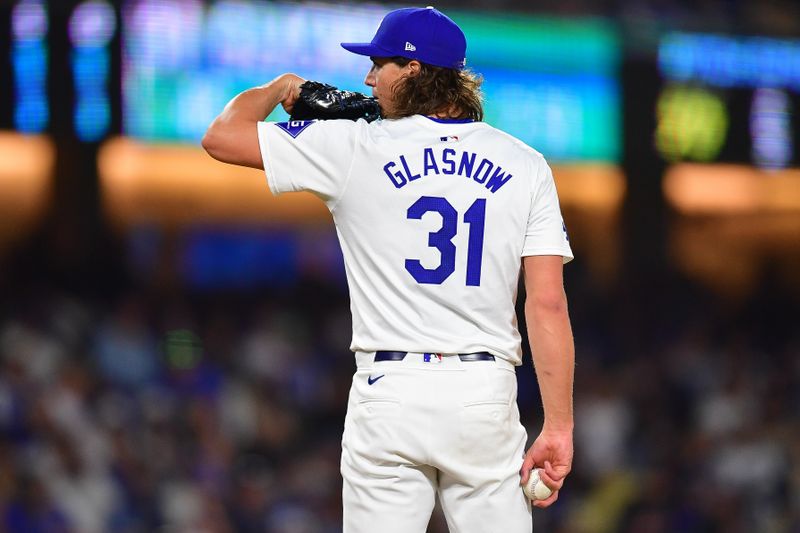 Apr 3, 2024; Los Angeles, California, USA; Los Angeles Dodgers starting pitcher Tyler Glasnow (31) throws against the San Francisco Giants during the fourth inning at Dodger Stadium. Mandatory Credit: Gary A. Vasquez-USA TODAY Sports