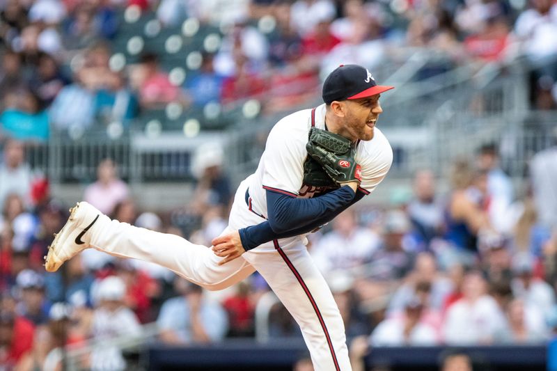 Sep 29, 2024; Cumberland, Georgia, USA; Atlanta Braves pitcher Dylan Lee (52) pitches the ball against the Kansas City Royals during  the ninth inning at Truist Park. Mandatory Credit: Jordan Godfree-Imagn Images