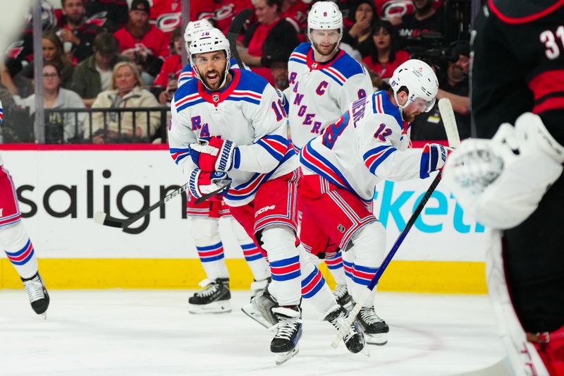 May 16, 2024; Raleigh, North Carolina, USA; New York Rangers center Vincent Trocheck (16) celebrates his goal against the Carolina Hurricanes during the third period in game six of the second round of the 2024 Stanley Cup Playoffs at PNC Arena. Mandatory Credit: James Guillory-USA TODAY Sports