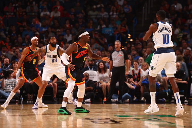 OKLAHOMA CITY, OK - APRIL 14:  Luguentz Dort #5 of the Oklahoma City Thunder plays defense during the game against the Dallas Mavericks on April 14, 2024 at Paycom Arena in Oklahoma City, Oklahoma. NOTE TO USER: User expressly acknowledges and agrees that, by downloading and or using this photograph, User is consenting to the terms and conditions of the Getty Images License Agreement. Mandatory Copyright Notice: Copyright 2024 NBAE (Photo by Zach Beeker/NBAE via Getty Images)