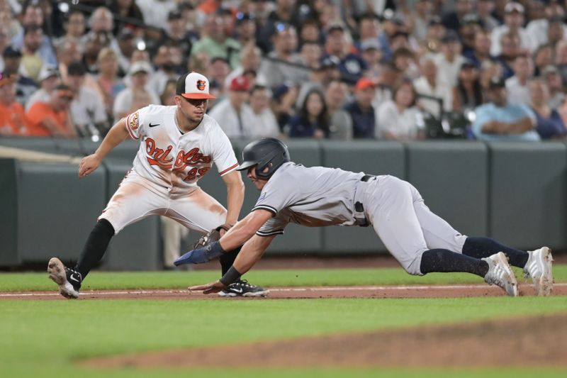 Jul 29, 2023; Baltimore, Maryland, USA; Baltimore Orioles third baseman Ramon Urias (29) tags New York Yankees center fielder Isiah Kiner-Falefa (12) out during the seventh inning  at Oriole Park at Camden Yards. Mandatory Credit: Tommy Gilligan-USA TODAY Sports