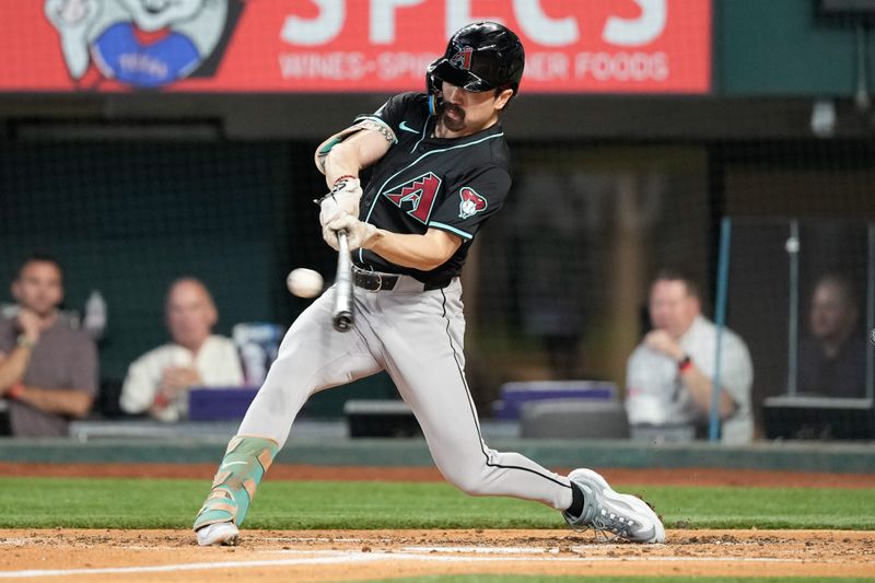 May 29, 2024; Arlington, Texas, USA; Arizona Diamondbacks center fielder Corbin Carroll (7) hits for a double against the Texas Rangers during the third inning at Globe Life Field. Mandatory Credit: Jim Cowsert-USA TODAY Sports