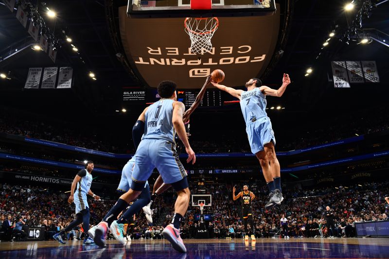 PHOENIX, AZ - FEBRUARY 11:  Santi Aldama #7 of the Memphis Grizzlies goes up for the rebound during the game against the Phoenix Suns on February 11, 2025 at Footprint Center in Phoenix, Arizona. NOTE TO USER: User expressly acknowledges and agrees that, by downloading and or using this photograph, user is consenting to the terms and conditions of the Getty Images License Agreement. Mandatory Copyright Notice: Copyright 2025 NBAE (Photo by Barry Gossage/NBAE via Getty Images)