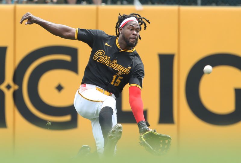 May 1, 2025; Pittsburgh, Pennsylvania, USA; Pittsburgh Pirates center fielder Oneil Cruz (15) makes a catch for an out against Chicago Cubs second baseman Nico Hoerner (not pictured) during the fourth inning at PNC Park. Mandatory Credit: Charles LeClaire-Imagn Images