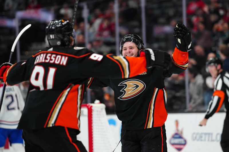 Nov 22, 2023; Anaheim, California, USA; Anaheim Ducks center Mason McTavish (23) and center Leo Carlsson (91) celebrate after a goal against the Montreal Canadiens in the second period at Honda Center. Mandatory Credit: Kirby Lee-USA TODAY Sports