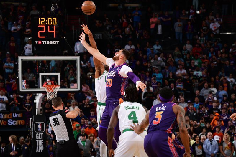 PHOENIX, AZ - MARCH  9: Al Horford #42 of the Boston Celtics and Jusuf Nurkic #20 of the Phoenix Suns go up for the opening tip off on March 9, 2024 at Footprint Center in Phoenix, Arizona. NOTE TO USER: User expressly acknowledges and agrees that, by downloading and or using this photograph, user is consenting to the terms and conditions of the Getty Images License Agreement. Mandatory Copyright Notice: Copyright 2024 NBAE (Photo by Kate Frese/NBAE via Getty Images)