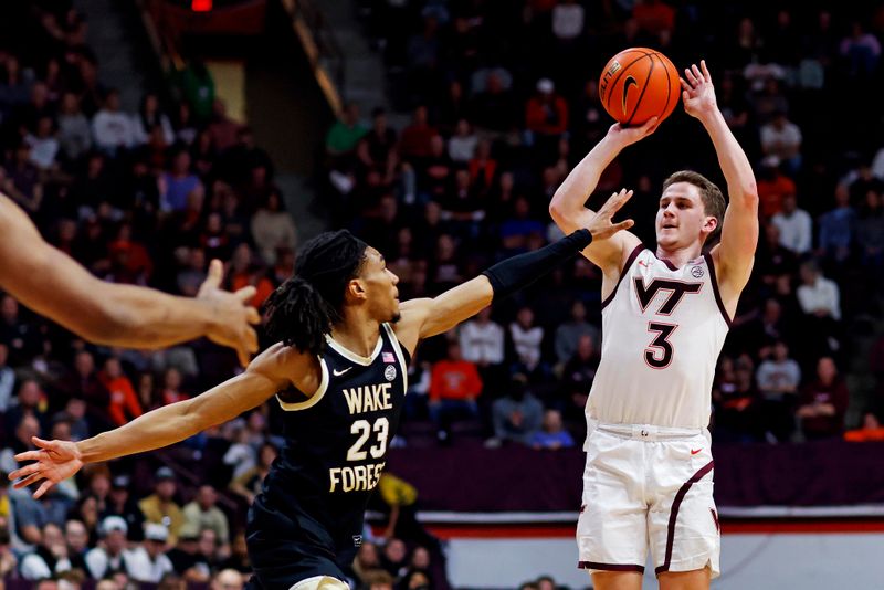 Mar 2, 2024; Blacksburg, Virginia, USA; Virginia Tech Hokies guard Sean Pedulla (3) shoots the ball against Wake Forest Demon Deacons guard Hunter Sallis (23) during the second half at Cassell Coliseum. Mandatory Credit: Peter Casey-USA TODAY Sports