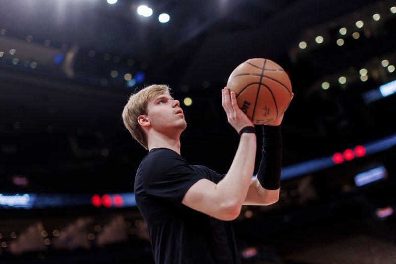 TORONTO, CANADA - FEBRUARY 28: Gradey Dick #1 of the Toronto Raptors warms up ahead of their NBA game against the Dallas Mavericks at Scotiabank Arena on February 28, 2024 in Toronto, Canada. NOTE TO USER: User expressly acknowledges and agrees that, by downloading and or using this photograph, User is consenting to the terms and conditions of the Getty Images License Agreement. (Photo by Cole Burston/Getty Images)