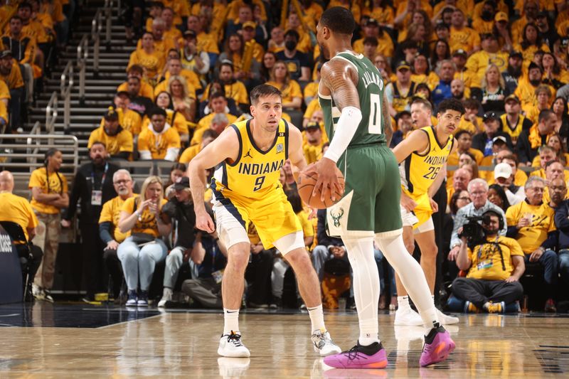 INDIANAPOLIS, IN - APRIL 26: T.J. McConnell #9 of the Indiana Pacers plays defense during the game against the Milwaukee Bucks during Round 1 Game 3 of the 2024 NBA Playoffs on April 26, 2024 at Gainbridge Fieldhouse in Indianapolis, Indiana. NOTE TO USER: User expressly acknowledges and agrees that, by downloading and or using this Photograph, user is consenting to the terms and conditions of the Getty Images License Agreement. Mandatory Copyright Notice: Copyright 2023 NBAE (Photo by Nathaniel S. Butler/NBAE via Getty Images)