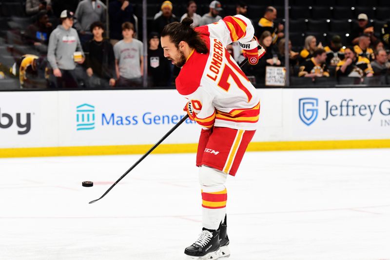 Nov 7, 2024; Boston, Massachusetts, USA;  Calgary Flames left wing Ryan Lomberg (70) handles the puck during warmups prior to a game against the Boston Bruins at TD Garden. Mandatory Credit: Bob DeChiara-Imagn Images