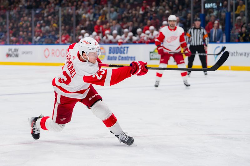 Feb 15, 2024; Vancouver, British Columbia, CAN; Detroit Red Wings forward Lucas Raymond (23) shoots against the Vancouver Canucks in the first period at Rogers Arena. Mandatory Credit: Bob Frid-USA TODAY Sports