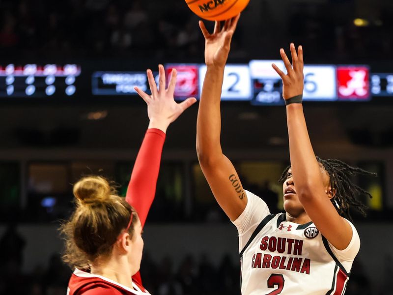 Feb 22, 2024; Columbia, South Carolina, USA; South Carolina Gamecocks forward Ashlyn Watkins (2) shoots over Alabama Crimson Tide forward Meg Newman (42) in the first half at Colonial Life Arena. Mandatory Credit: Jeff Blake-USA TODAY Sports