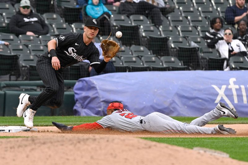 May 14, 2024; Chicago, Illinois, USA; Washington Nationals shortstop Nasim Nuñez (26) steals third base under Chicago White Sox second base Zach Remillard (1) during the eighth inning at Guaranteed Rate Field. Mandatory Credit: Matt Marton-USA TODAY Sports