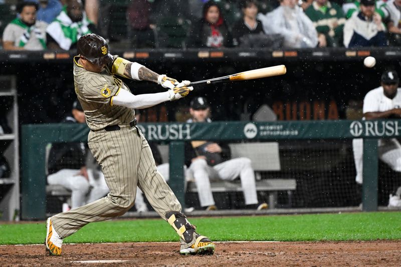 Sep 20, 2025; Chicago, Illinois, USA;  San Diego Padres third baseman Manny Machado (13) hits an RBI single against the Chicago White Sox during the sixth inning  at Rate Field. Mandatory Credit: Matt Marton-Imagn Images