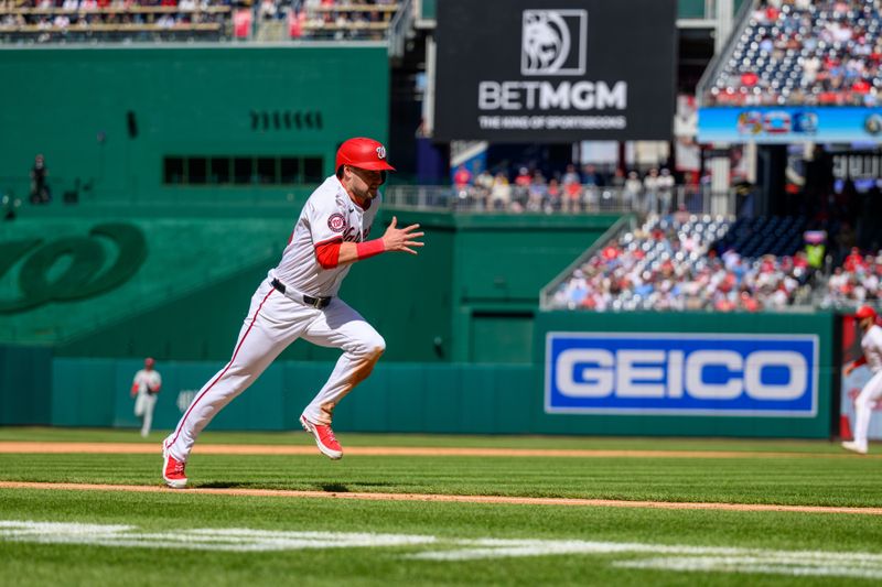 Apr 7, 2024; Washington, District of Columbia, USA; Washington Nationals outfielder Lane Thomas (28) scores a run during the fifth inning against the Philadelphia Phillies at Nationals Park. Mandatory Credit: Reggie Hildred-USA TODAY Sports