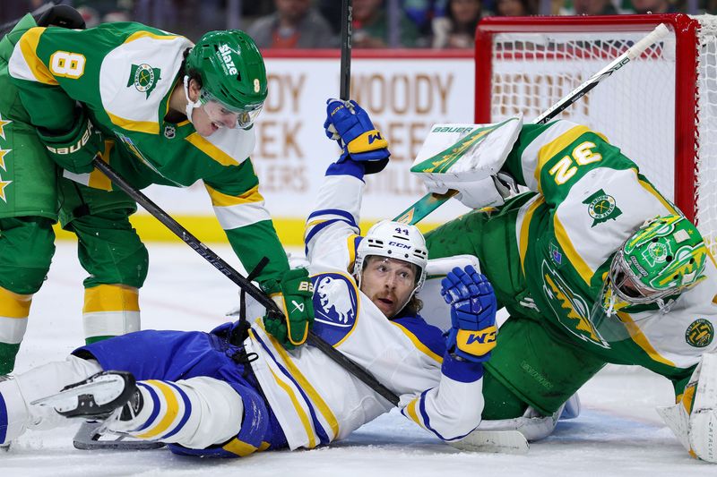 Nov 29, 2025; Saint Paul, Minnesota, USA; Minnesota Wild defenseman Zeev Buium (8) checks Buffalo Sabres center Josh Dunne (44) during the second period at Grand Casino Arena. Mandatory Credit: Matt Krohn-Imagn Images