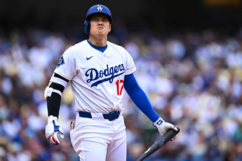 Apr 27, 2025; Los Angeles, California, USA; Los Angeles Dodgers designated hitter Shohei Ohtani (17) reacts at bat against the Pittsburgh Pirates during the fourth inning at Dodger Stadium. Mandatory Credit: Jonathan Hui-Imagn Images