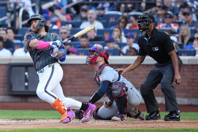 Sep 20, 2025; New York City, New York, USA; New York Mets catcher Francisco Alvarez (4) hits a single in the second inning against the Washington Nationals at Citi Field. Mandatory Credit: Wendell Cruz-Imagn Images