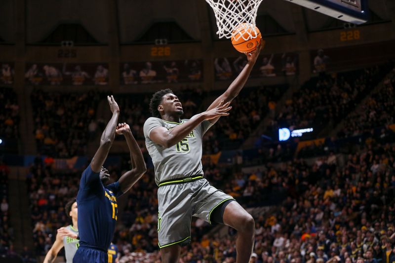 Feb 17, 2024; Morgantown, West Virginia, USA; Baylor Bears forward Josh Ojianwuna (15) shoots in the lane during the first half against the West Virginia Mountaineers at WVU Coliseum. Mandatory Credit: Ben Queen-USA TODAY Sports