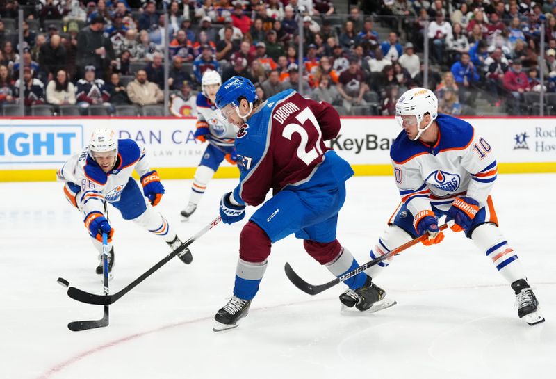 Apr 18, 2024; Denver, Colorado, USA; Edmonton Oilers center Derek Ryan (10) and defenseman Philip Broberg (86) defend on Colorado Avalanche left wing Jonathan Drouin (27) in the second period at Ball Arena. Mandatory Credit: Ron Chenoy-USA TODAY Sports