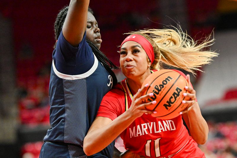 Feb 18, 2024; College Park, Maryland, USA;  Maryland Terrapins guard Jakia Brown-Turner (11) makes a move to there basket on Penn State Nittany Lions guard Ashley Owusu (0) during the second  half at Xfinity Center. Mandatory Credit: Tommy Gilligan-USA TODAY Sports