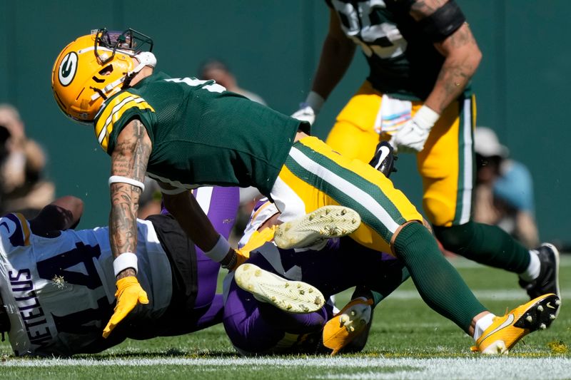 Green Bay Packers wide receiver Christian Watson is injured on a play during the first half of an NFL football game against the Minnesota Vikings, Sunday, Sept. 29, 2024, in Green Bay, Wis. (AP Photo/Morry Gash)