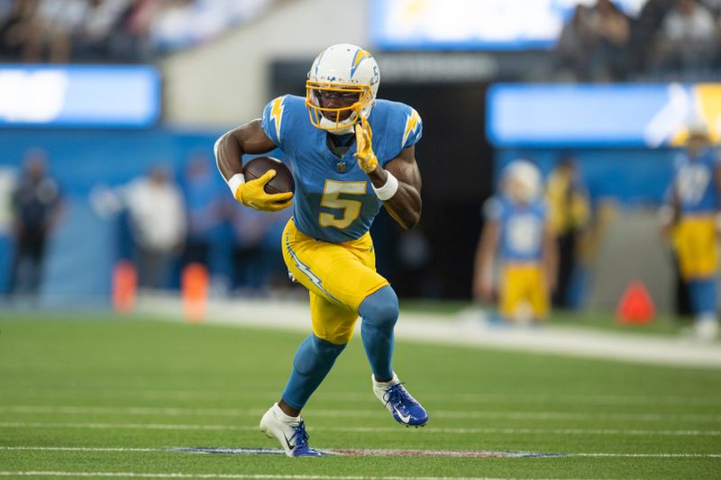 Los Angeles Chargers wide receiver Joshua Palmer (5) runs with the ball during an NFL football game against the Dallas Cowboys, Monday, Oct. 16, 2023, in Inglewood, Calif. (AP Photo/Kyusung Gong)