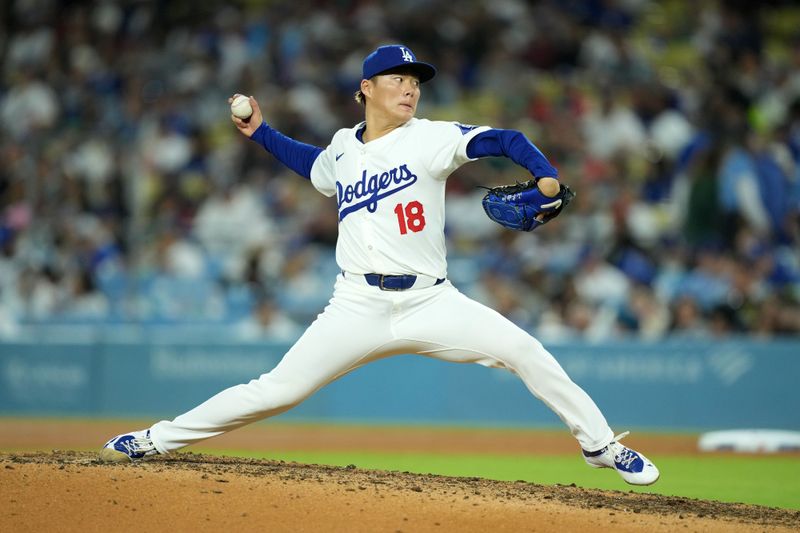 May 7, 2024; Los Angeles, California, USA; Los Angeles Dodgers pitcher Yoshinobu Yamamoto (18) throws in the eighth inning against the Miami Marlins at Dodger Stadium. Mandatory Credit: Kirby Lee-USA TODAY Sports