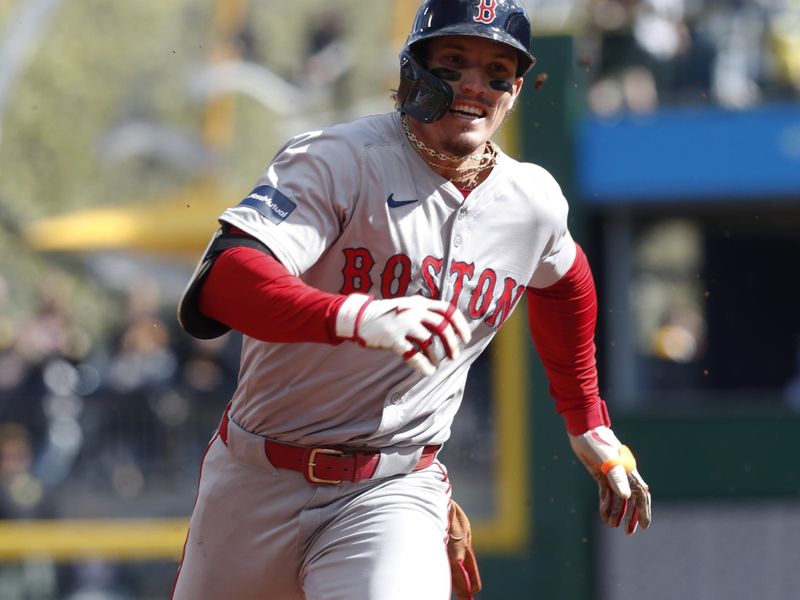 Apr 20, 2024; Pittsburgh, Pennsylvania, USA; Boston Red Sox center fielder Jarren Duran (16) runs to third base with a lead off triple against the Pittsburgh Pirates during the first inning at PNC Park. Mandatory Credit: Charles LeClaire-USA TODAY Sports